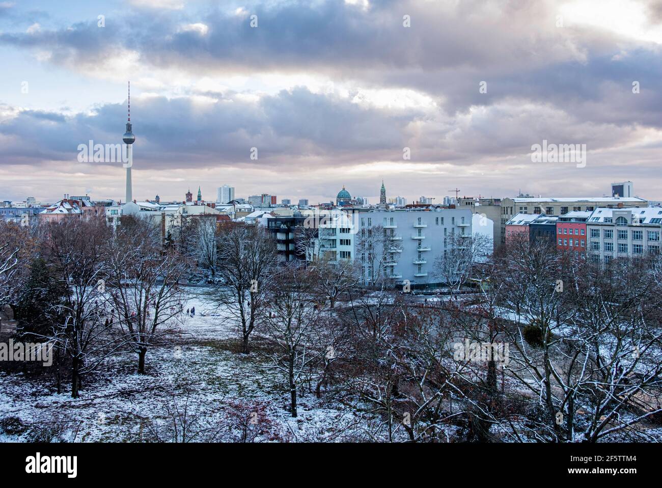 Berlin Skyline with TV tower & snow covered trees In Weinberg Park, Mitte, Berlin, Germany. Winter weather Stock Photo