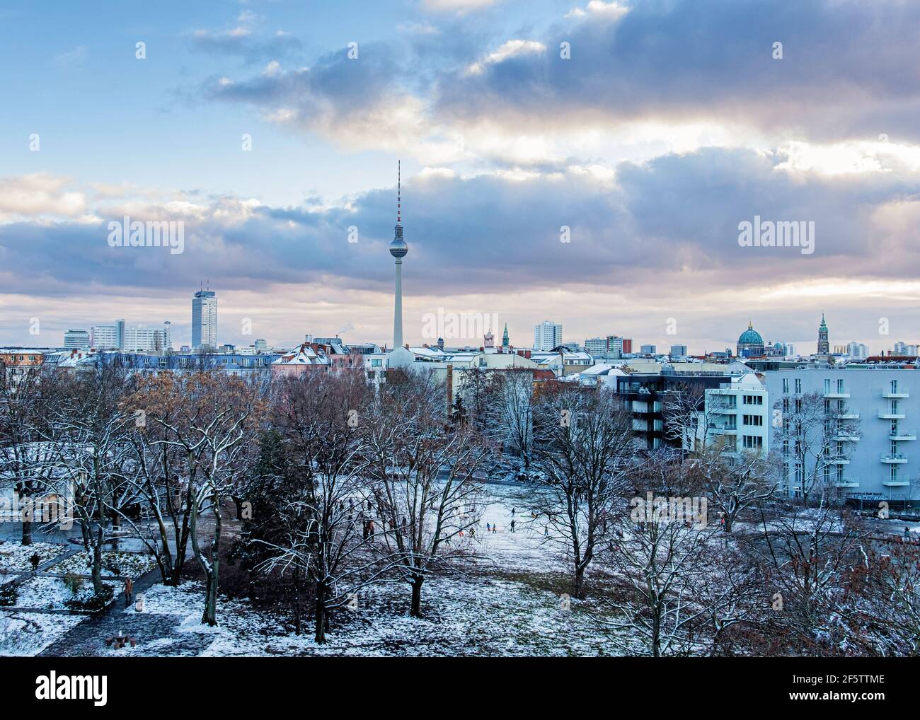 Berlin Skyline with TV tower & snow covered trees In Weinberg Park, Mitte, Berlin, Germany. Winter weather Stock Photo