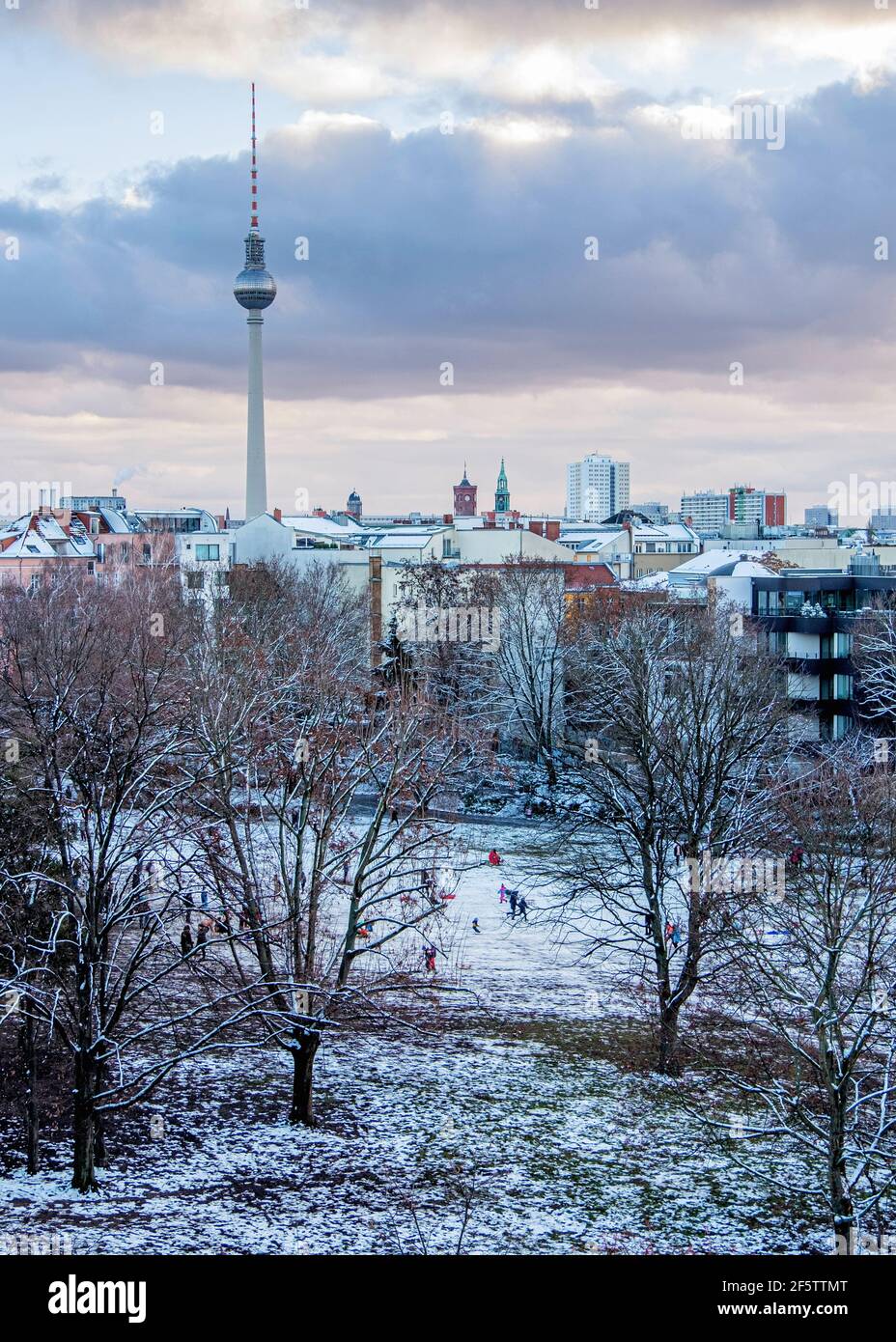 Berlin Skyline with TV tower & snow covered trees In Weinberg Park, Mitte, Berlin, Germany. Winter weather Stock Photo