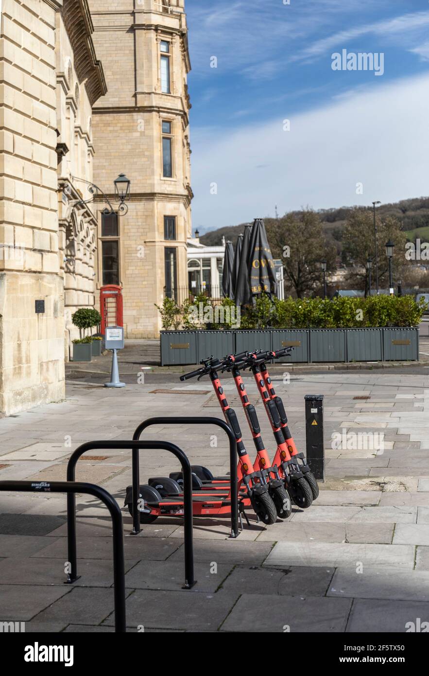 As part of a trial E-scooters are available to hire near The Guildhall in the City of Bath, Somerset, England, UK Stock Photo