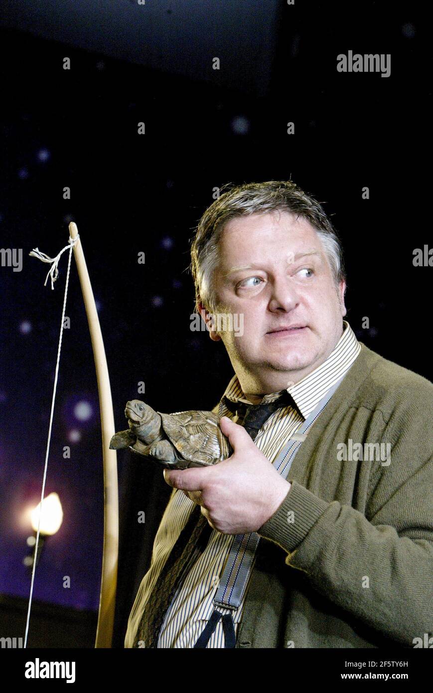 Simon Russell Beale (George Moore) in JUMPERS by Tom Stoppard at the Lyttelton Theatre, National Theatre (NT), London SE1  19/06/2003  set design: Vicki Mortimer  costumes: Nicky Gillibrand  lighting: Paule Constable  choreography: Aidan Treays  director: David Leveaux Stock Photo