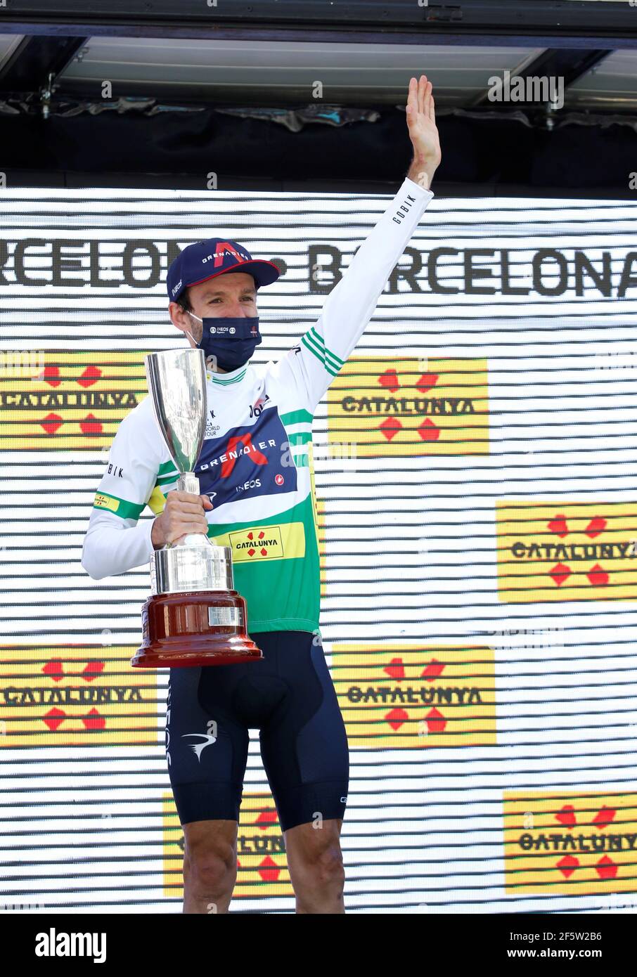 Port Aine, Spain. 28th Mar, 2021. Overall winner British cyclist Adam Yates of Ineos team celebrates on the podium after the seventh and last stage of La Volta a Catalunya cycling race? over 133 kms starting and finishing in Barcelona, Catalonia, north-eastern Spain, 28 March 2021. Credit: Toni Albir/EFE/Alamy Live News Stock Photo
