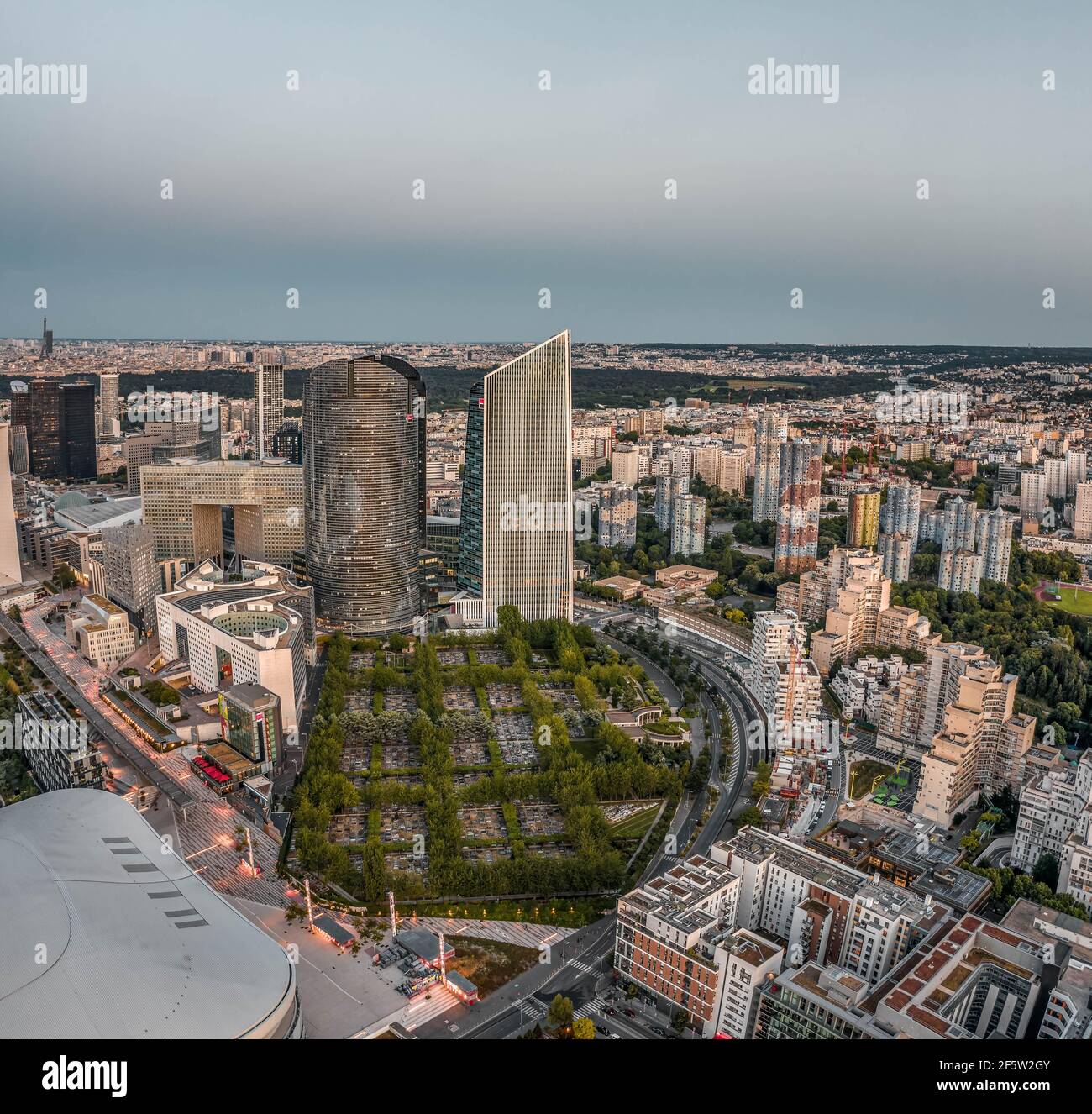 Paris, France - Jun 20, 2020: Aerial drone shot of La Defense Cemetry post pandemic lockdown after sunset Stock Photo