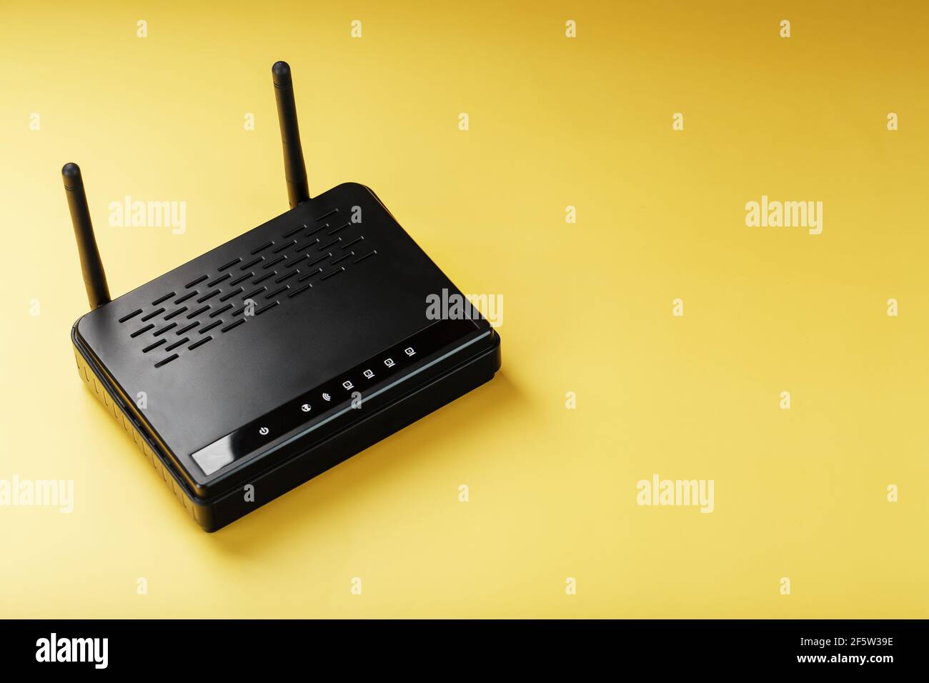 Router wireless LAN technology with devices based on IEEE 802.11 standards on a yellow background free space top view. Isolate Stock Photo