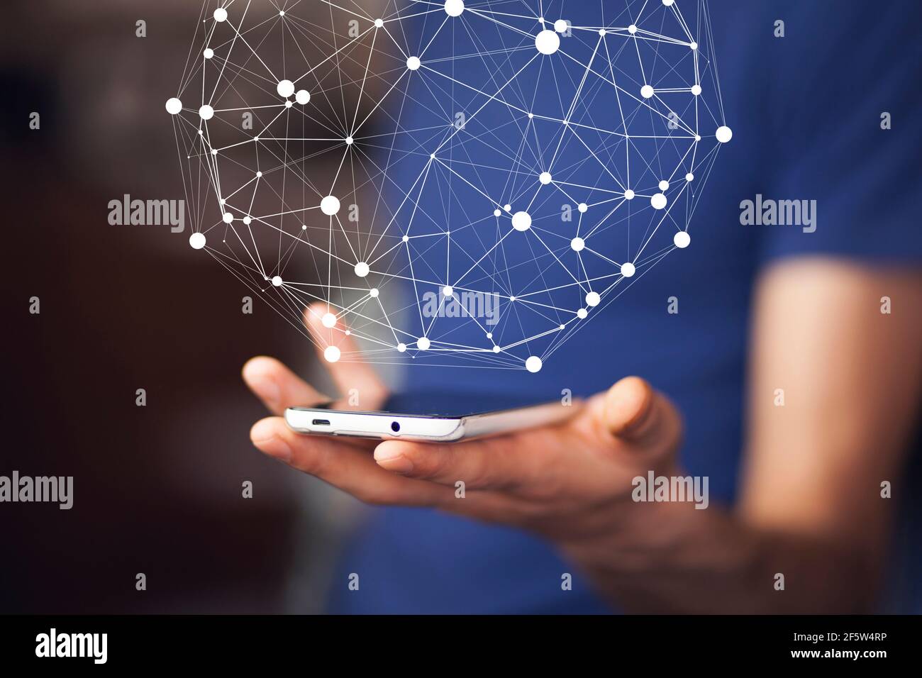 Businessman on blurred background using circle igital data network with mobile phone Stock Photo