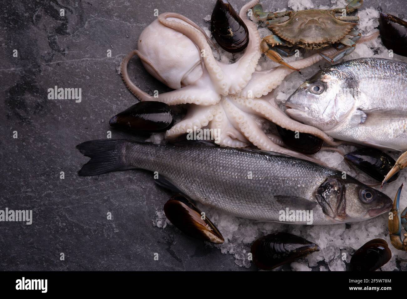 fresh fish and seafood arrangement on marble table Stock Photo - Alamy