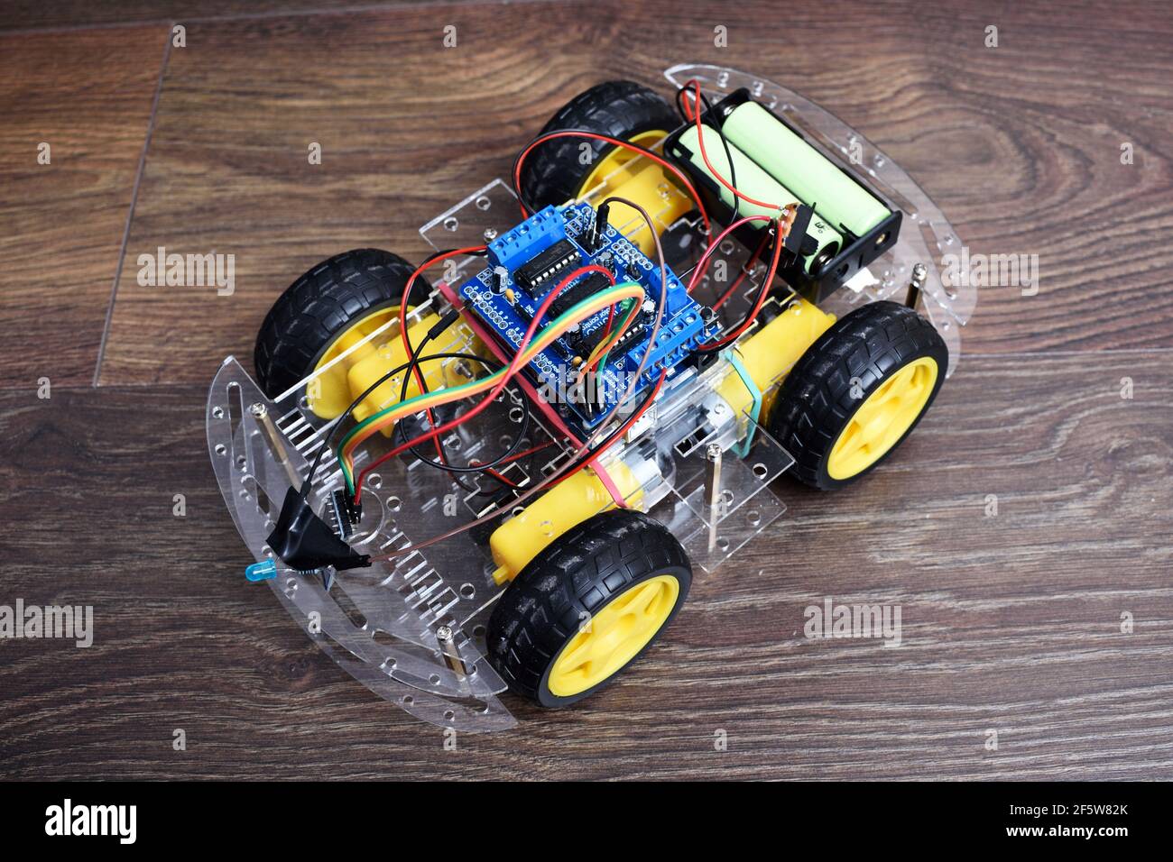Arduino project - remote controlled car with bluetooth module. Car with 4  motors and controller Stock Photo - Alamy