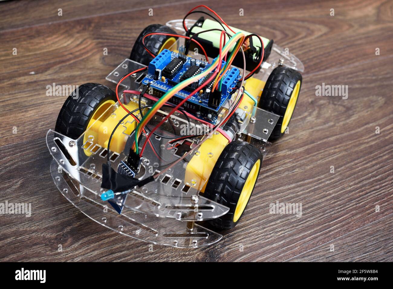 Arduino project - remote controlled car with bluetooth module. Car with 4  motors and controller Stock Photo - Alamy