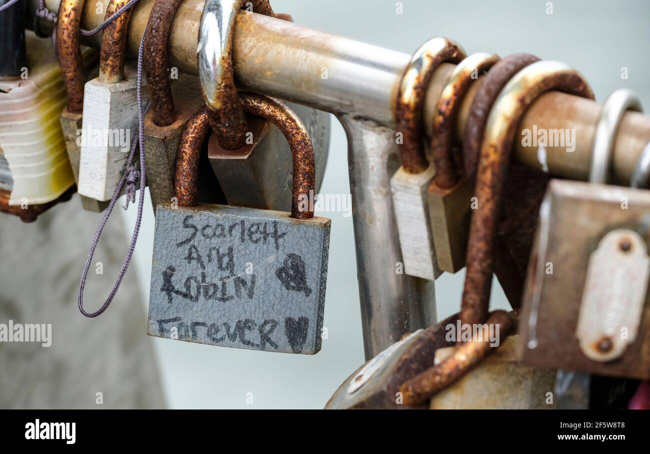 Love locks placed on Pero's bridge in Bristol city center. Sweethearts place locks on the bridge as momentos. Stock Photo