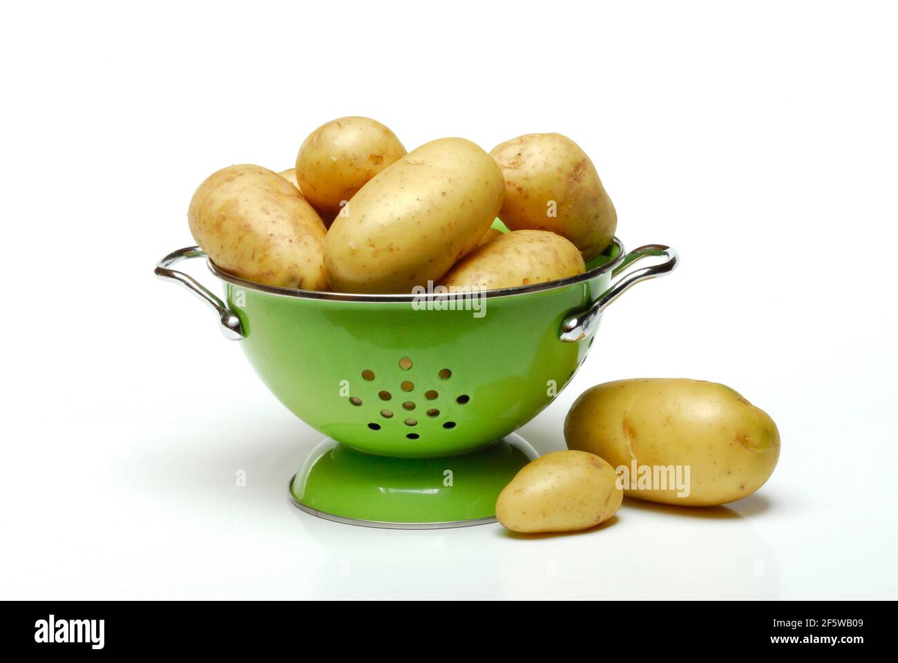 Potatoes in sieve Stock Photo