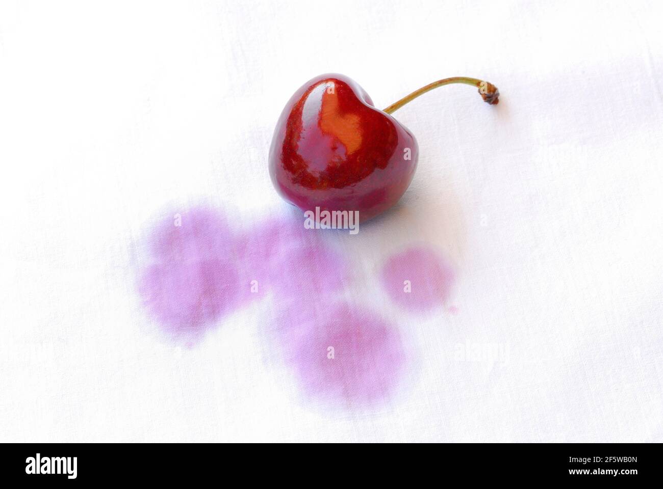 Stain, stains, cherry stain on fabric, cherry stain, cherry, cherry Stock Photo