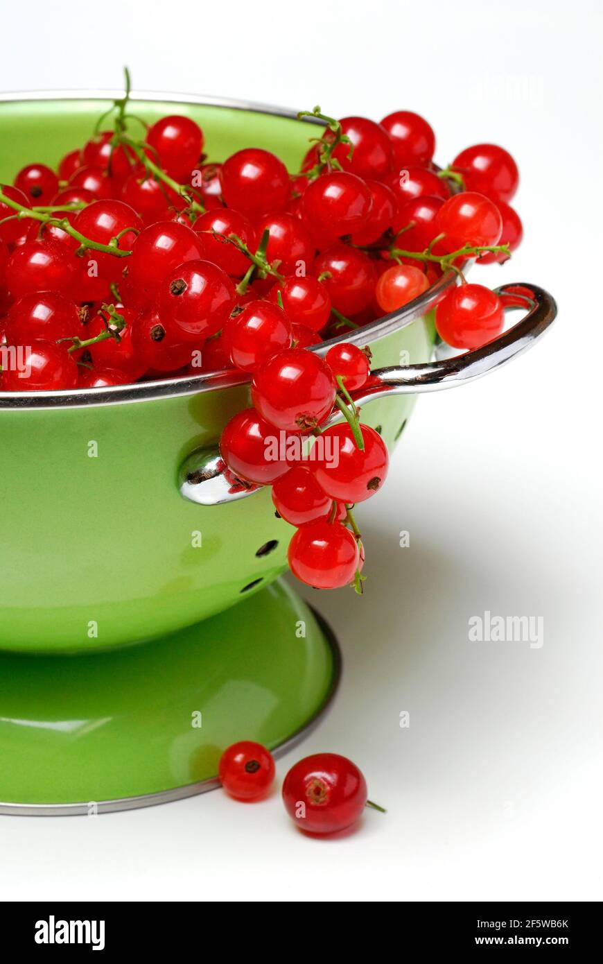 Redcurrants in kitchen sieve ( Ribes rubrum) , strainer, carbon copy Stock Photo
