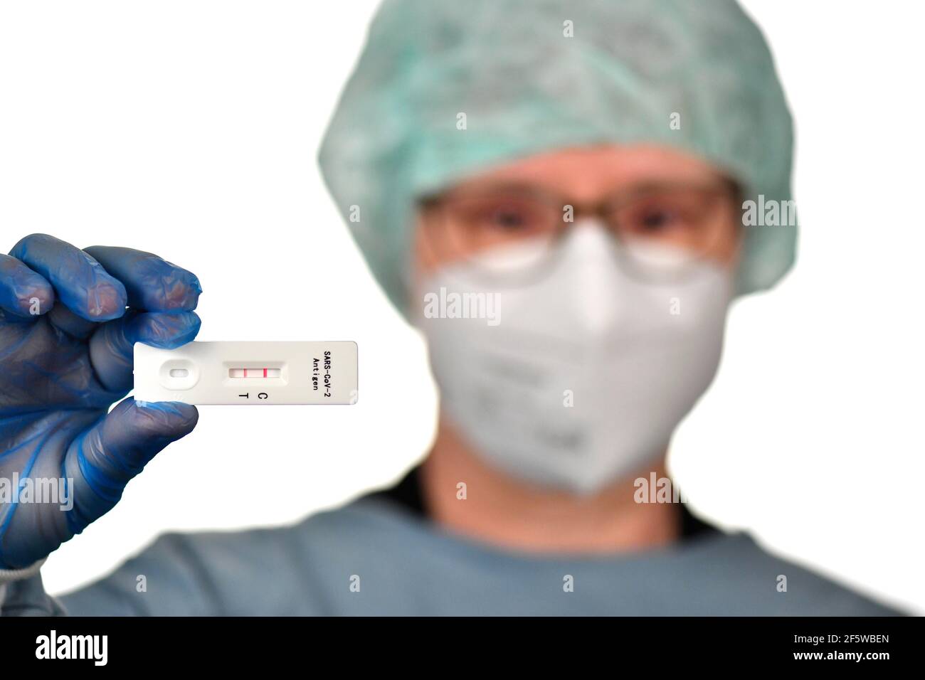 Medical staff shows positive antigen rapid test, test cassette, Corona crisis, Germany Stock Photo