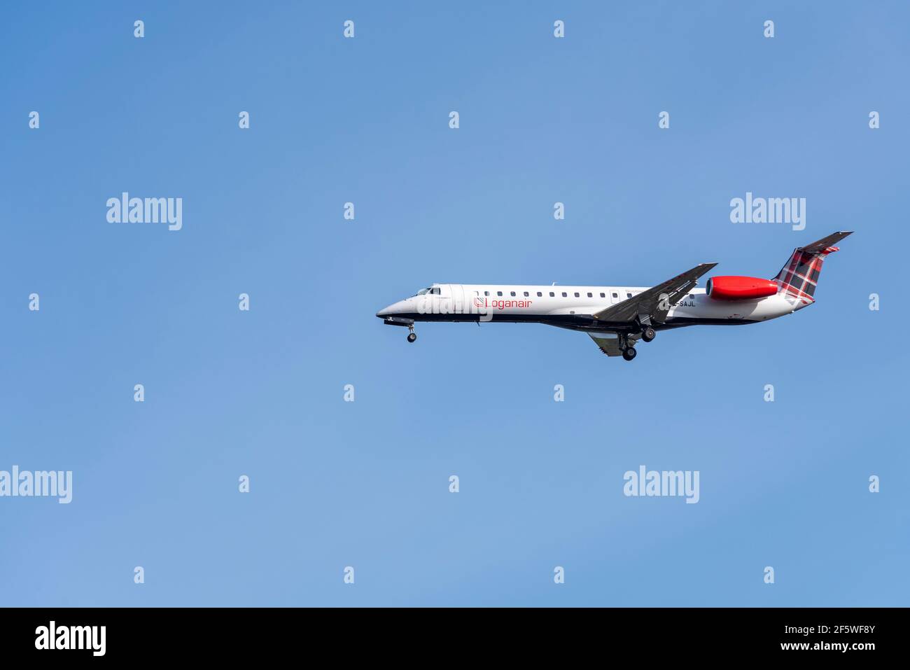 Loganair Embraer ERJ 145 jet airliner plane G-SAJL on finals to land at  London Heathrow Airport, UK, in blue sky. Scottish airline Stock Photo -  Alamy