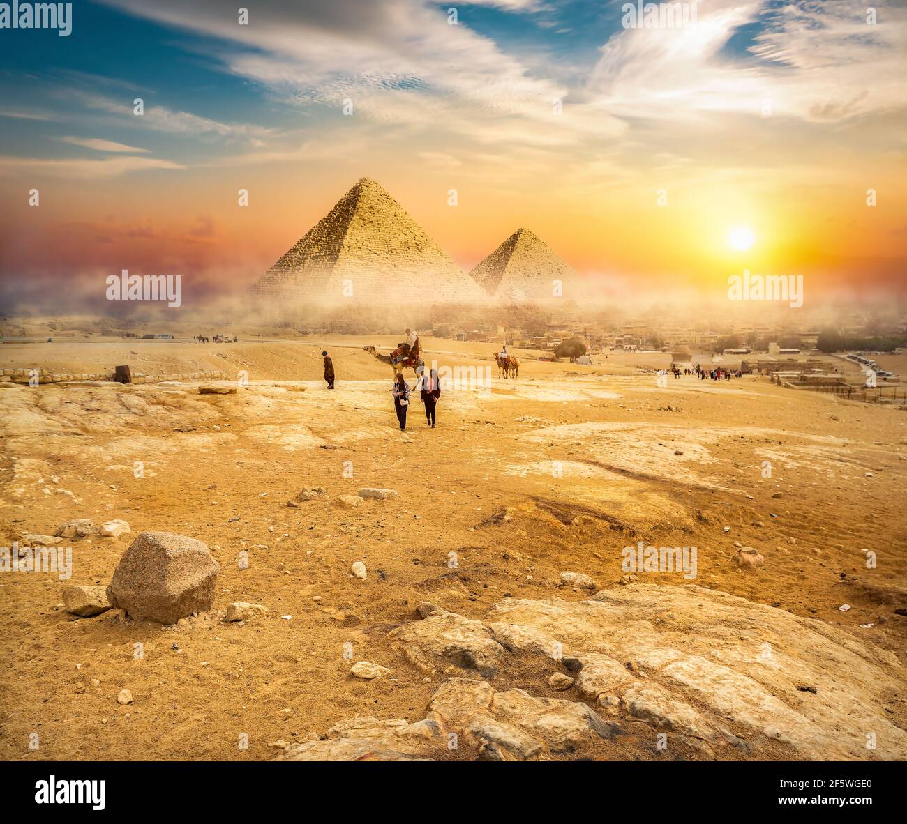 Egyptian pyramids in the desert at sunset Stock Photo