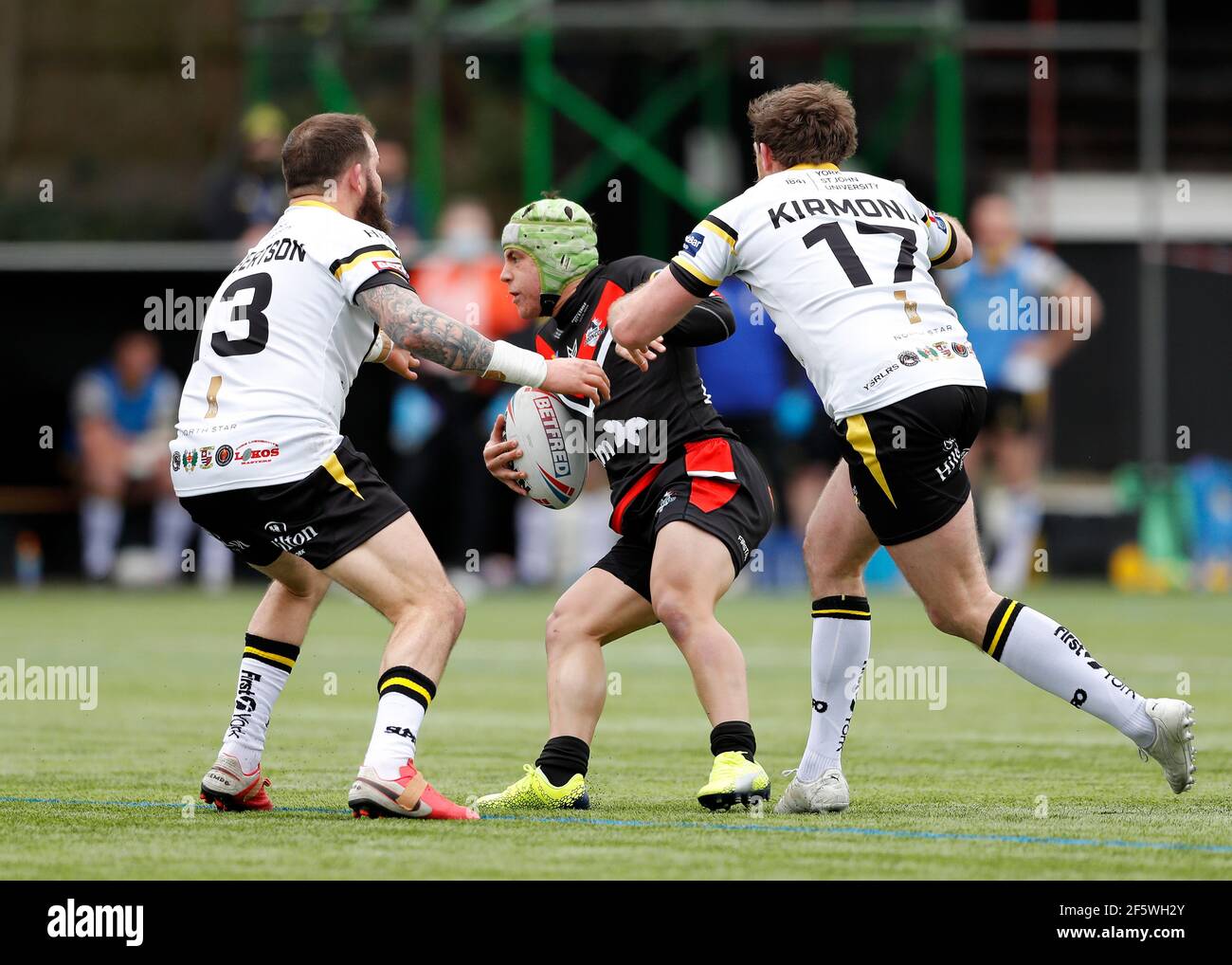 Rosslyn Park, London, UK. 28th Mar, 2021. Betfred Challenge Cup, Rugby League, London Broncos versus York City Knights; Oilver Leyland of London Broncos is tackled by Danny Kirmond and Adam Cuthbertson of York City Knights Credit: Action Plus Sports/Alamy Live News Stock Photo