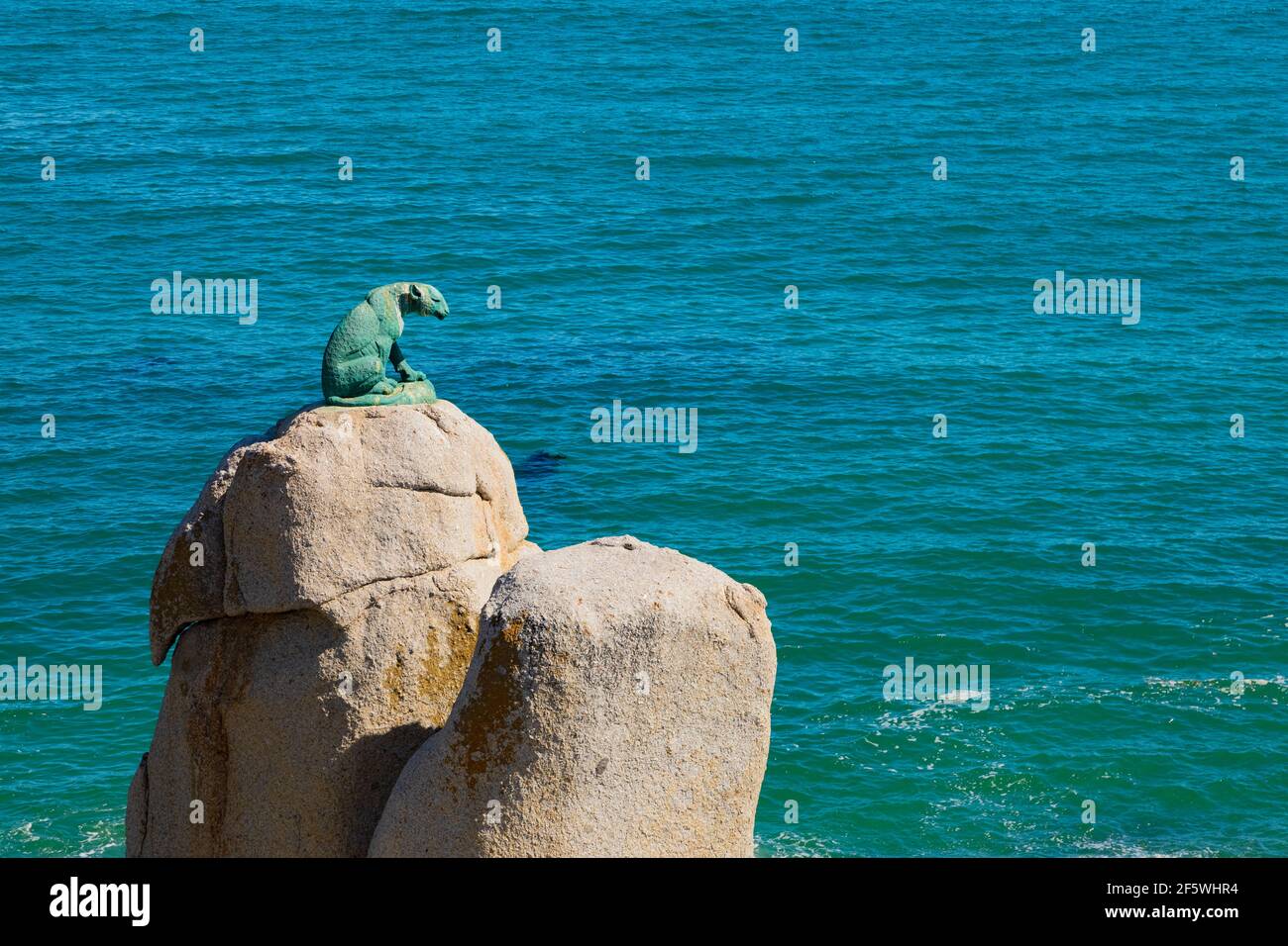 Cape Town, South Africa - March 17, 2021: Bronze Leopard statue on rock in Hout Bay Cape Town, South Africa Stock Photo