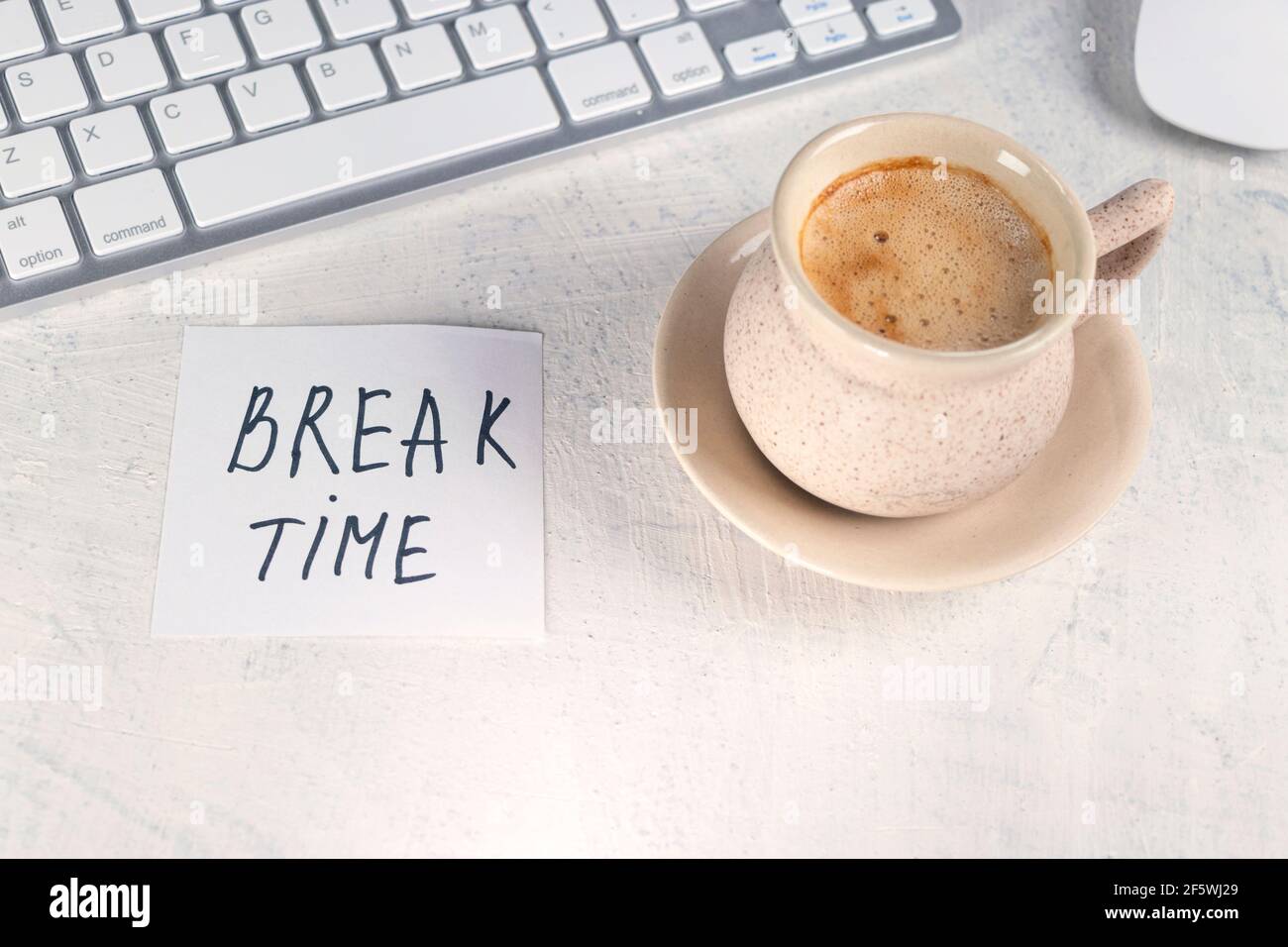 Break time. Concept time off. Words BREAK TIME in note on the working table  with cup of coffee and keyboard. Top view Stock Photo - Alamy