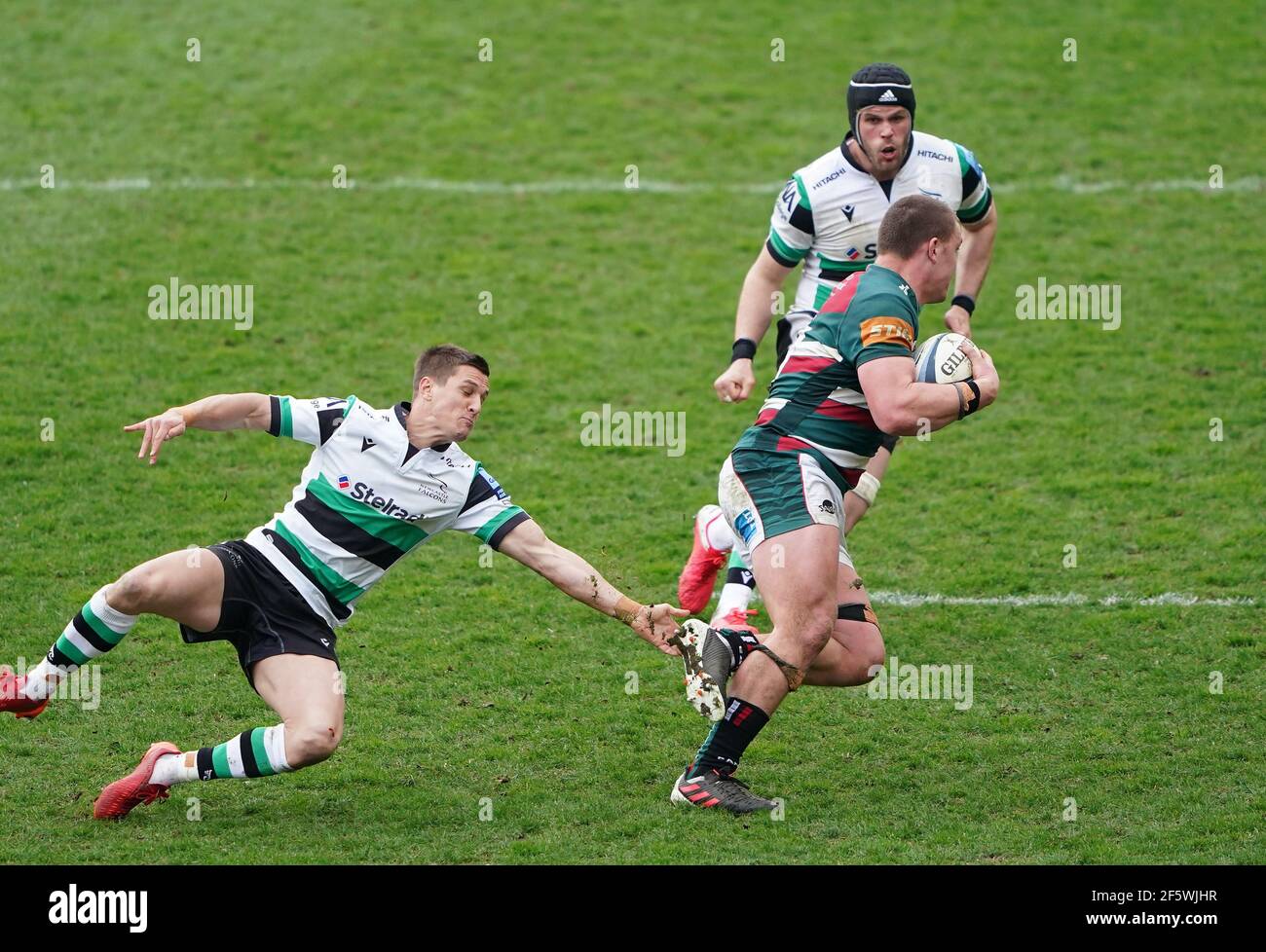 Leicester Tigers' Jasper Wiese (right) evades a tackle from Newcastle Falcons' Louis Schreuder during the Gallagher Premiership match at the Mattioli Woods Welford Road Stadium, Leicester. Picture date: Sunday March 28, 2021. Stock Photo