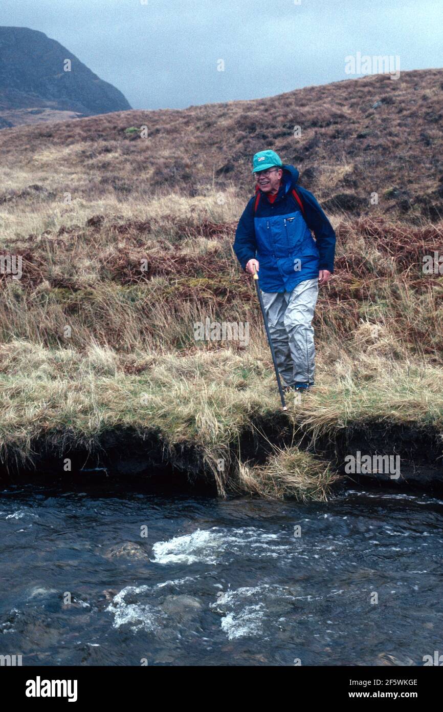Olympic gold medallist, London Marathon founder, journalist and Brasher Boot inventor Chris Brasher CBE, crossing a mountain river, Knoydart, Scotland Stock Photo