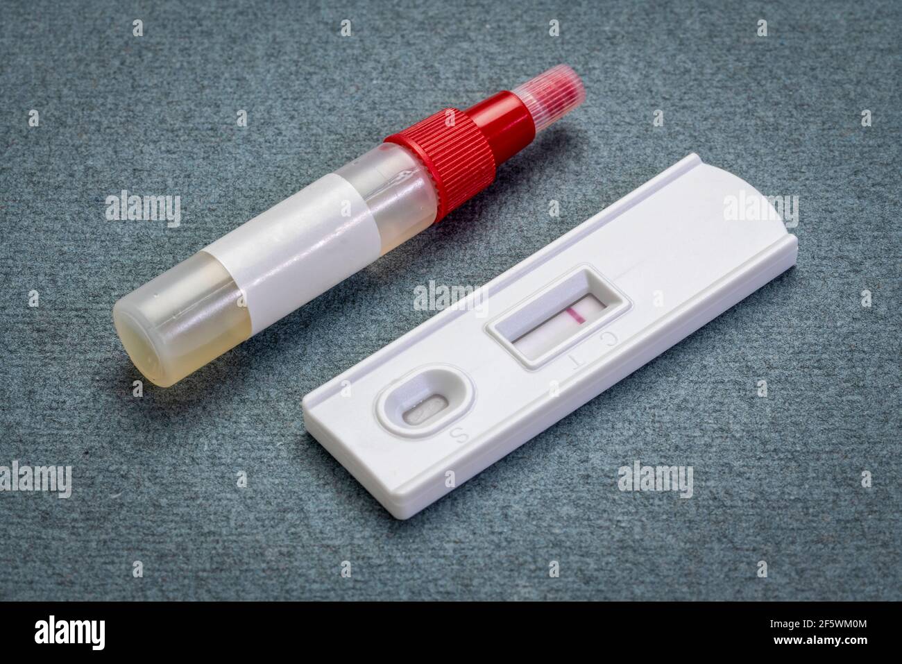 fecal immunochemical test for  colorectal diseases - home kit with a collecting tube and a negative result on a test cassette, health and self care co Stock Photo