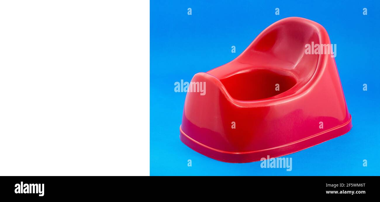 Red plastic potty for children Text space Stock Photo Alamy