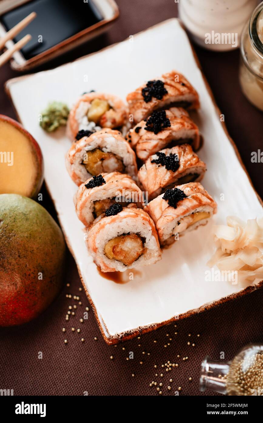 Beautifully served sushi with mango and eel topped with sauce Stock Photo -  Alamy