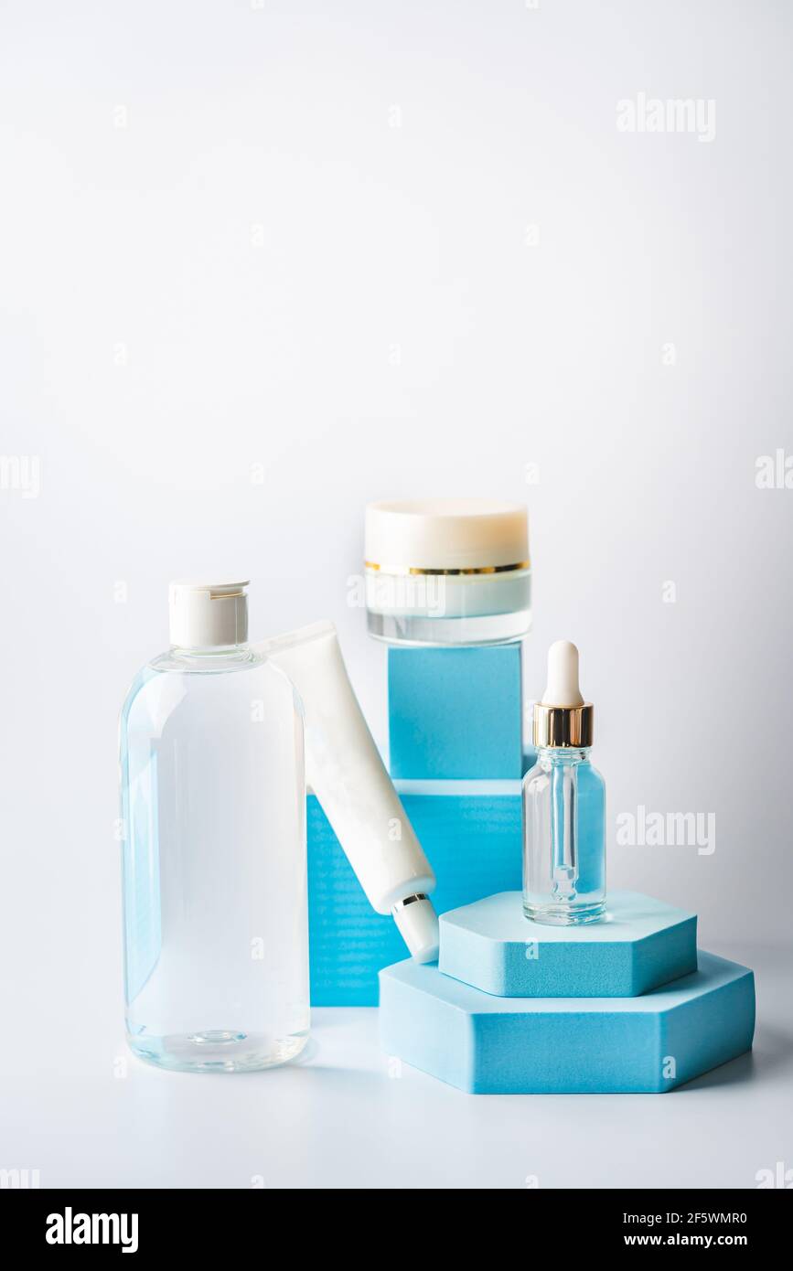 Glass cosmetic bottle with oil or serum and cream for skin care on ...