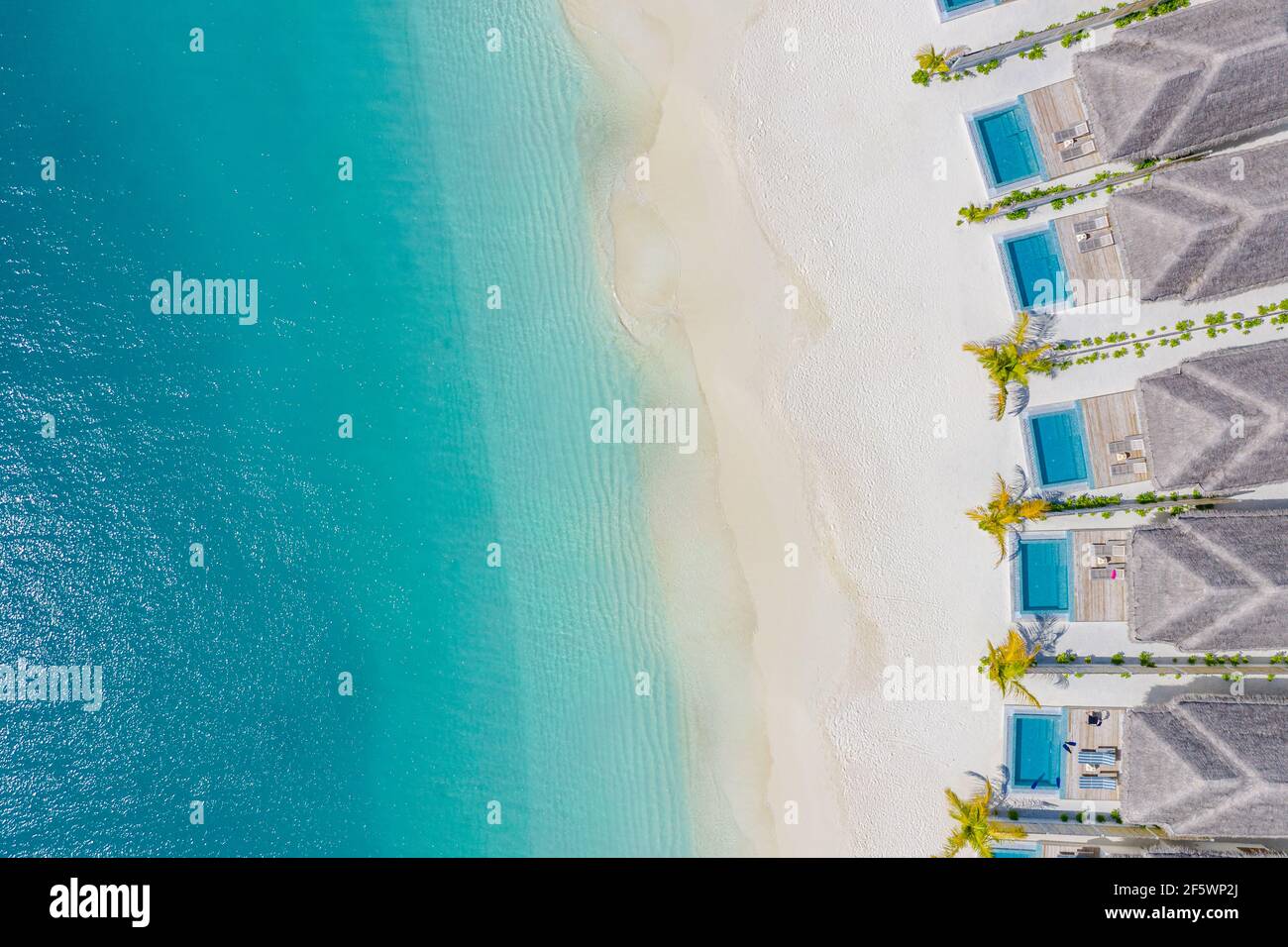 Maldives paradise scenery. Tropical aerial landscape, seascape with long jetty, water villas with amazing sea and exotic lagoon beach, tropical nature Stock Photo
