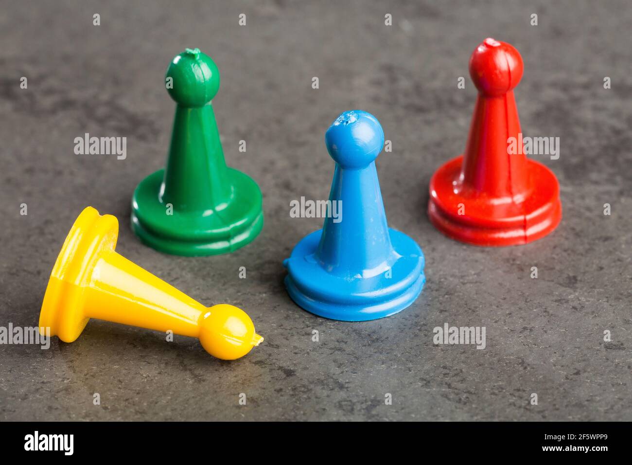 Game pieces with dices on slate Stock Photo