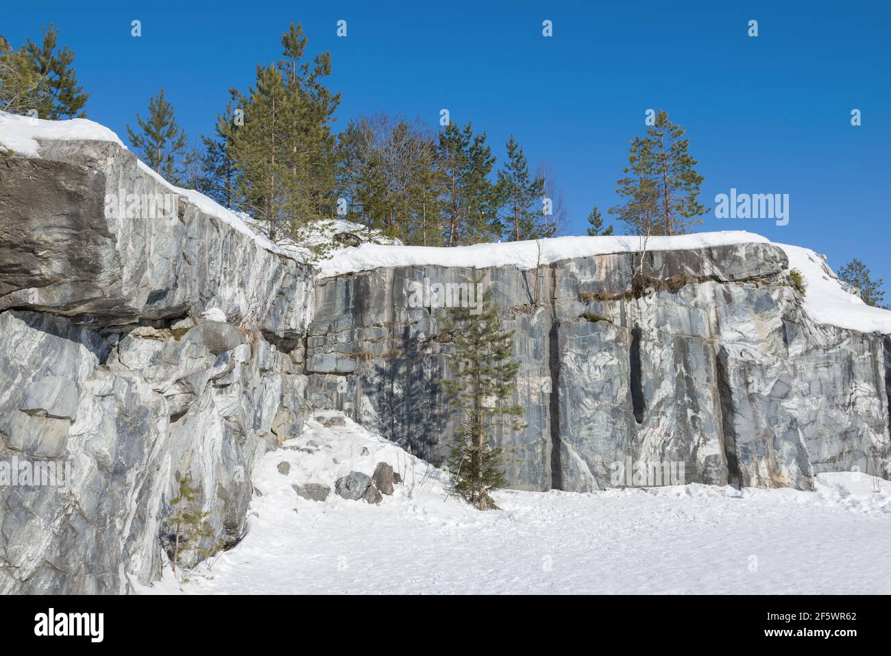 In old Italian marble quarry on a March day. Mountain Park 'Ruskeala'. Karelia, Russia Stock Photo