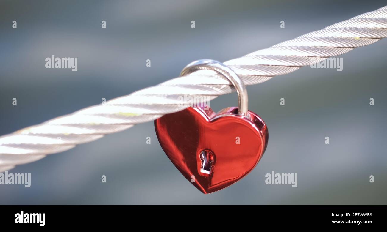 Red love lock at a fence in form of a heart Stock Photo - Alamy