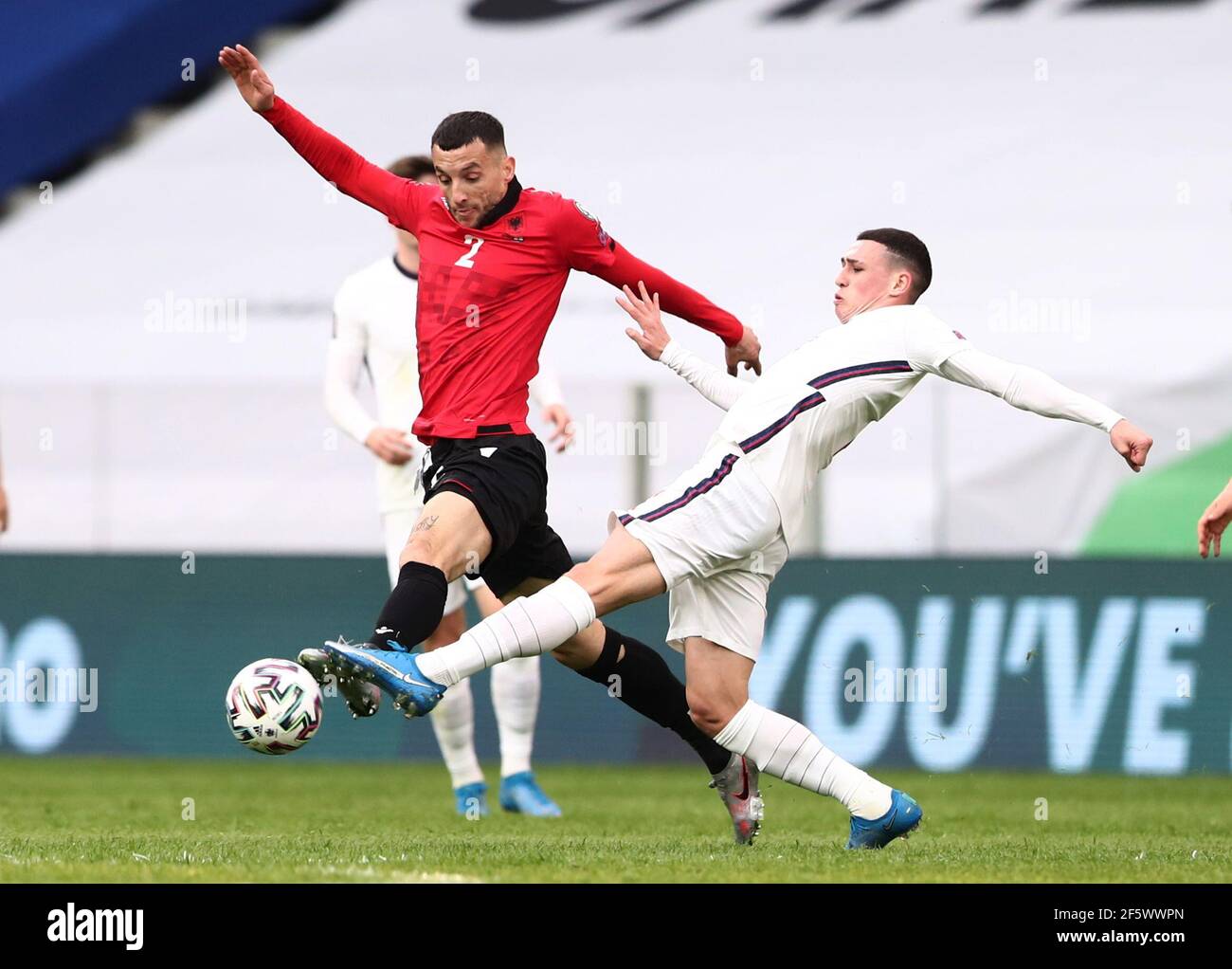 Soccer Football - World Cup Qualifiers Europe - Group I - Albania v England - Arena Kombetare, Tirana, Albania - March 28, 2021 England's Phil Foden in action with Albania's Hysen Memolla REUTERS/Marko Djurica Stock Photo
