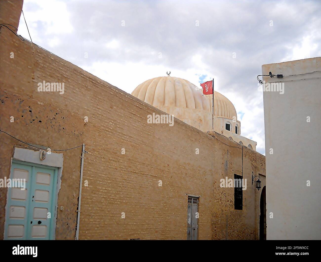 Zaouia de Sidi Amor Aba covered by domes with inside an exhibition of giant objects covered with writing. Stock Photo