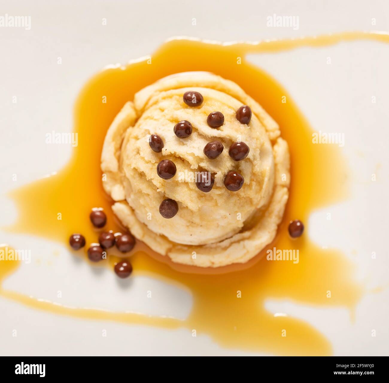 Chocolate chips vanilla ice cream on white background Stock Photo - Alamy