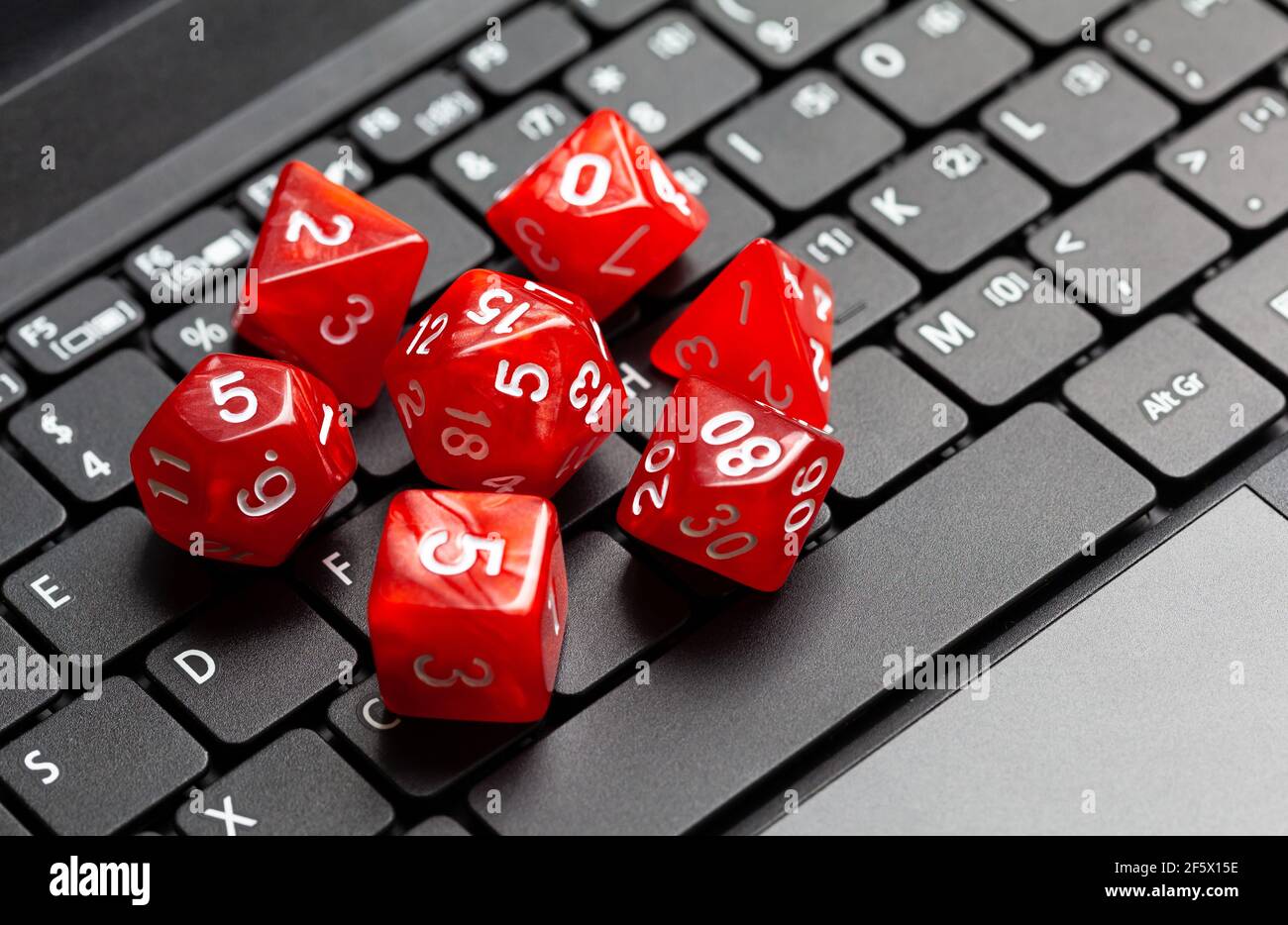 Set of simple red RPG role playing fantasy board game dice laying on a