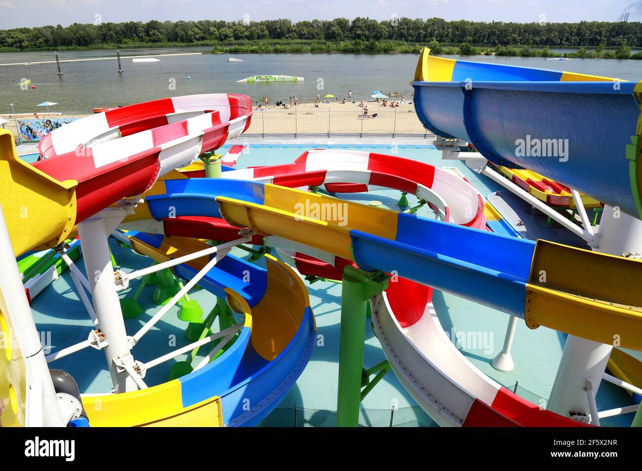 Colorful plastic water-slides in aqua park. Part of the water park - a slide element of blue, yellow, red, white. Dnipro city, Ukraine. Dnepropetrovsk Stock Photo