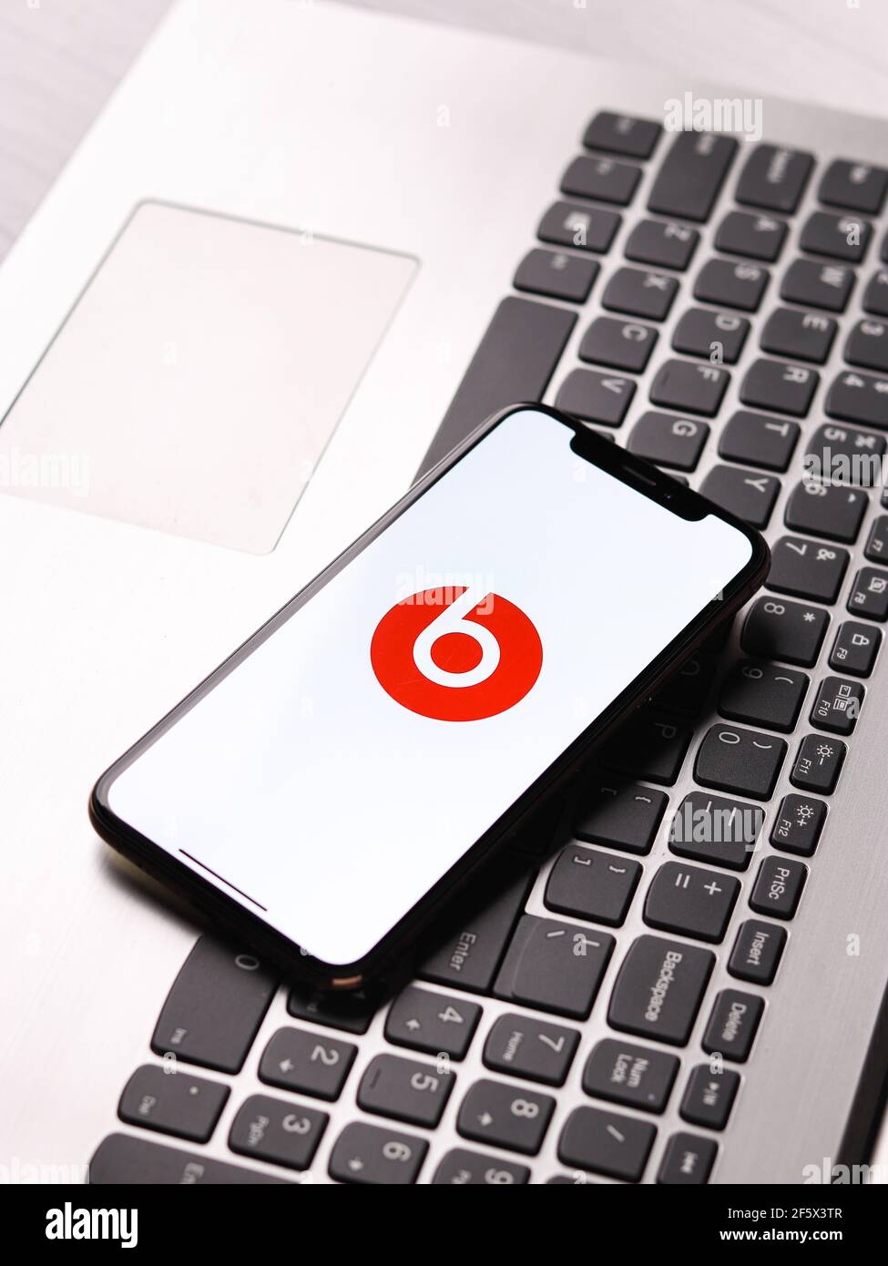 Assam, india - March 30, 2021 : Beats Pill logo on phone screen stock image. Stock Photo