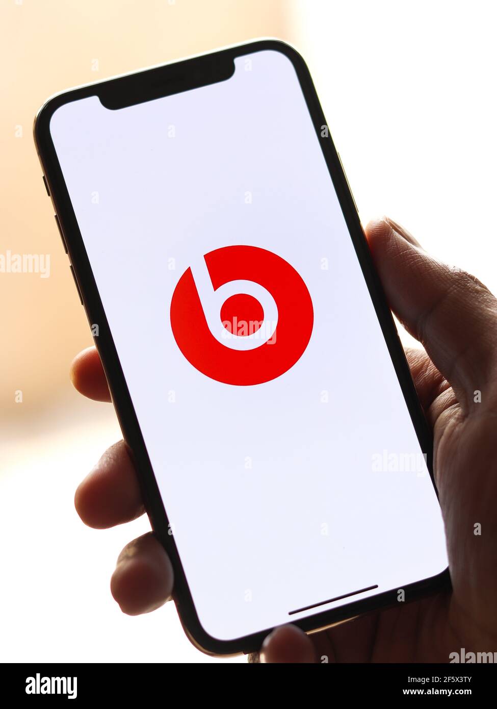 Beats Pill logo on phone screen stock 