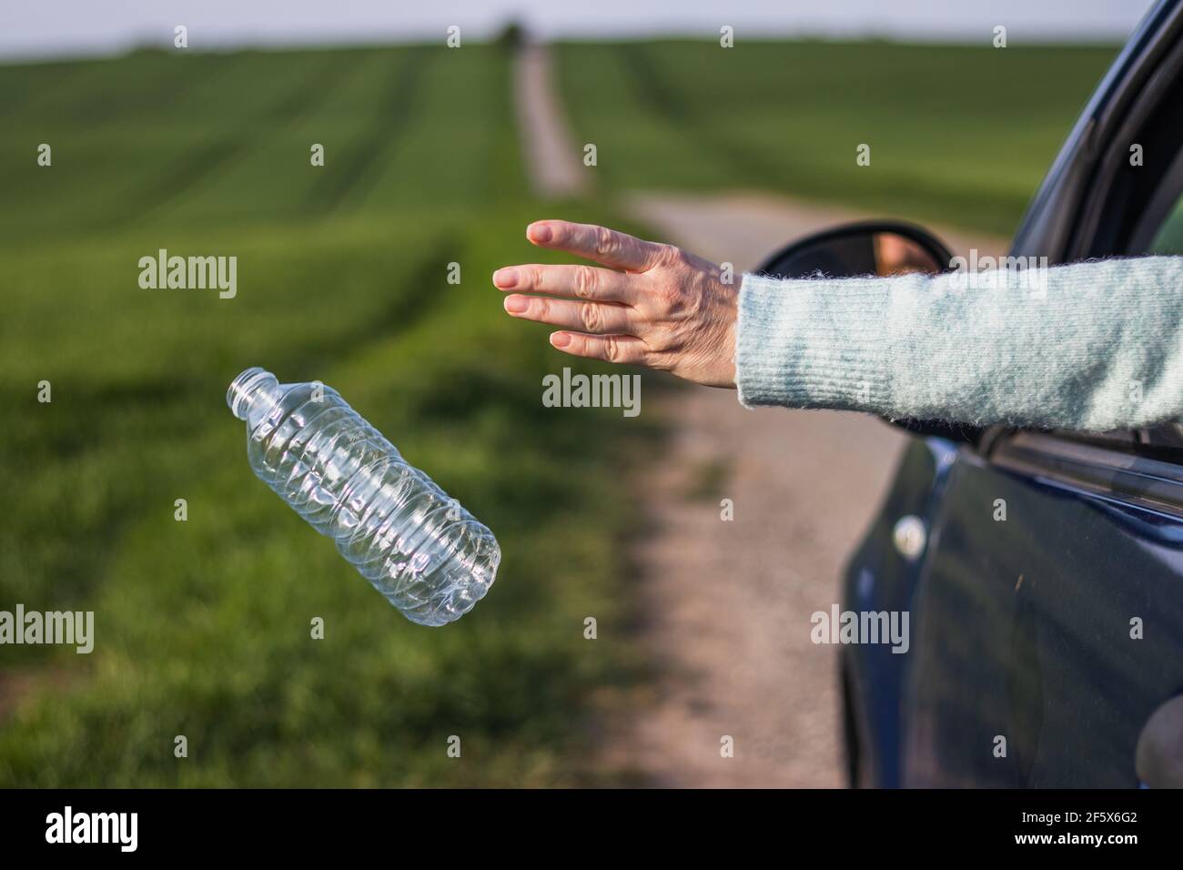 Person throwing away garbage hires stock photography and images Alamy