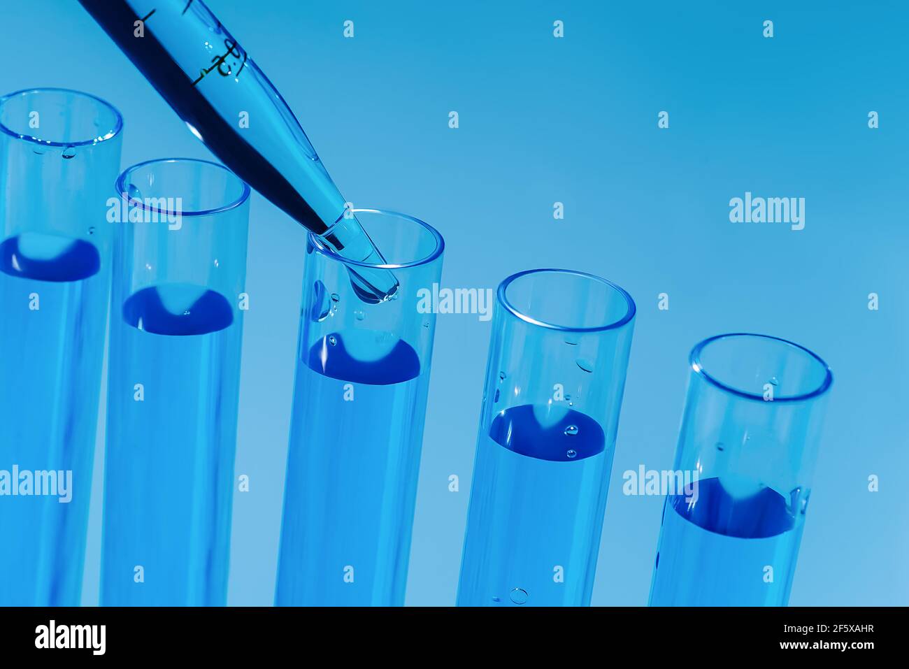 The dropper fills the sample vials for testing. Pharmaceutical