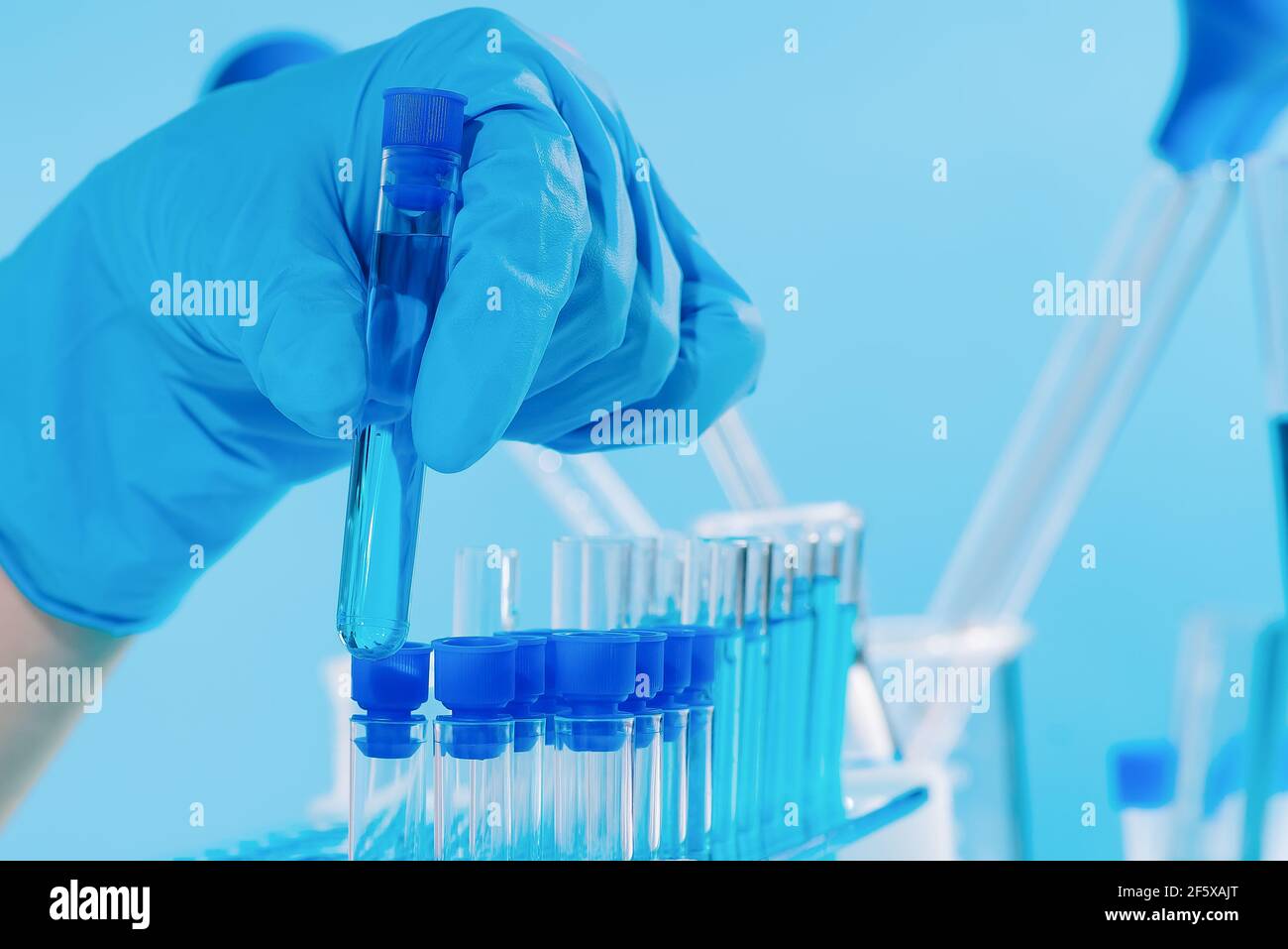 The dropper fills the sample vials for testing. Pharmaceutical