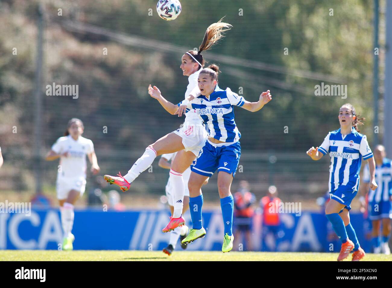 Noelia Villegas of Deportivo Abanca competes for the ball with Kosovare Asllani of Real Madrid during the women's first division Iberdrola league Stock Photo