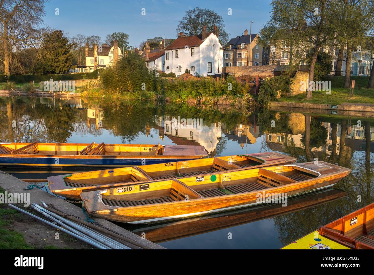 River Cam with punts and reflections showing riverside houses in Cambridge England Stock Photo