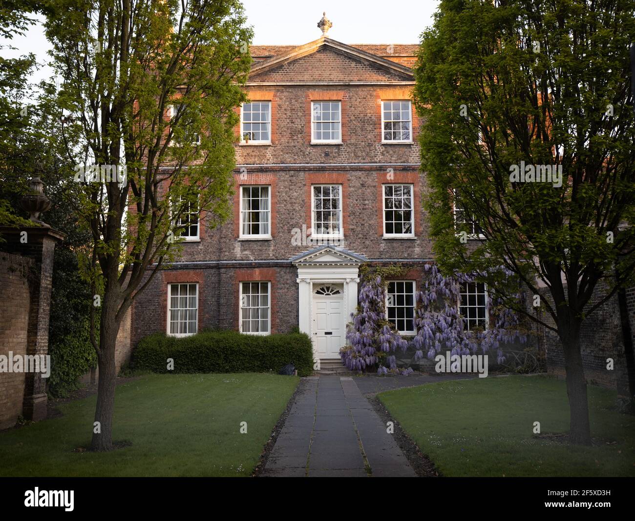Little Trinity 16 Jesus Lane Cambridge a symmetrical circ 1725 three storey building with brown and red brick and brick bands between storeys. Stock Photo