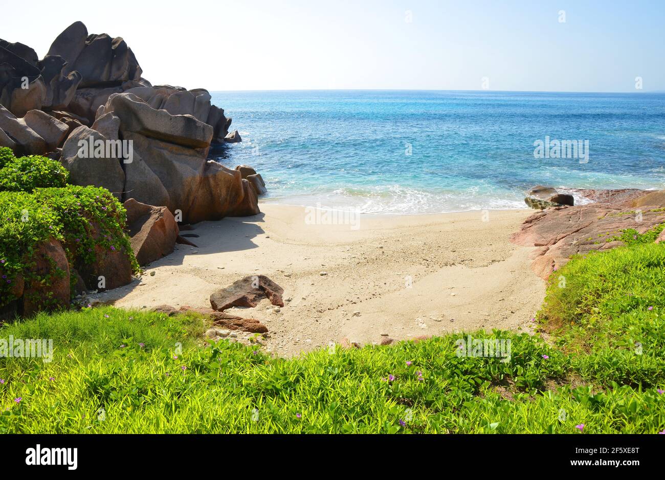 Tropical landscape with big granite rocks close to Anse Songe beach. La Digue Island, Seychelles. Stock Photo