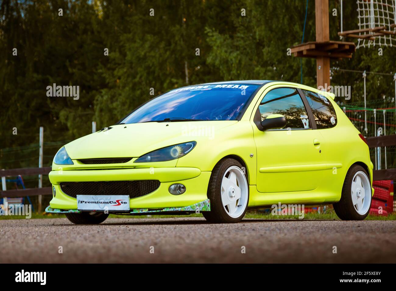 Moscow, Russia - July 06, 2019: Bright green, Peugeot 206 tuned with white  rims and lowered suspension. It is in the parking lot. Well-groomed car  drawn by a special film Stock Photo - Alamy