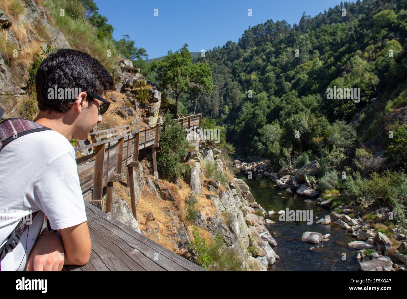 Hiker enjoying the view of the Paiva river, at Passadiços do Paiva, Arouca, Portugal. Stock Photo