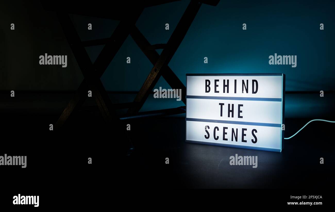 Behind the scenes light box. Text on cinema light box. Megaphone and ...