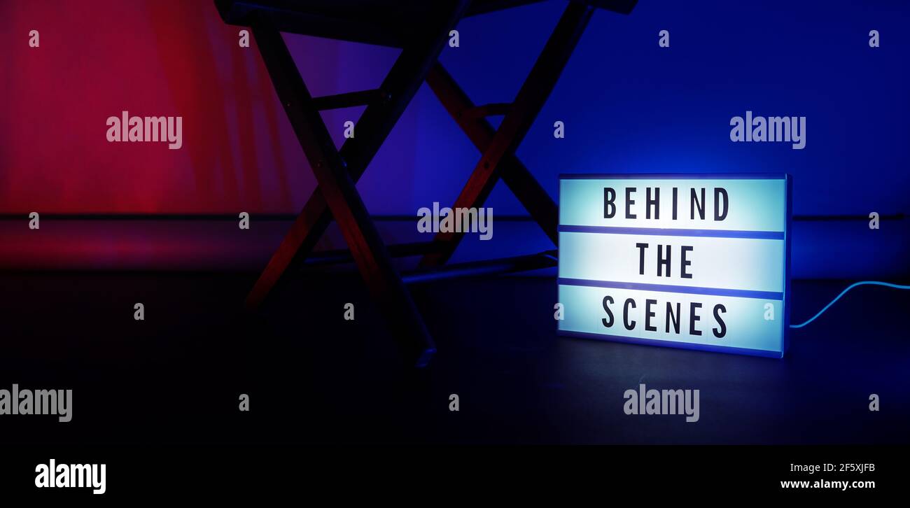 Behind the scenes light box. Text on cinema light box. Megaphone and ...